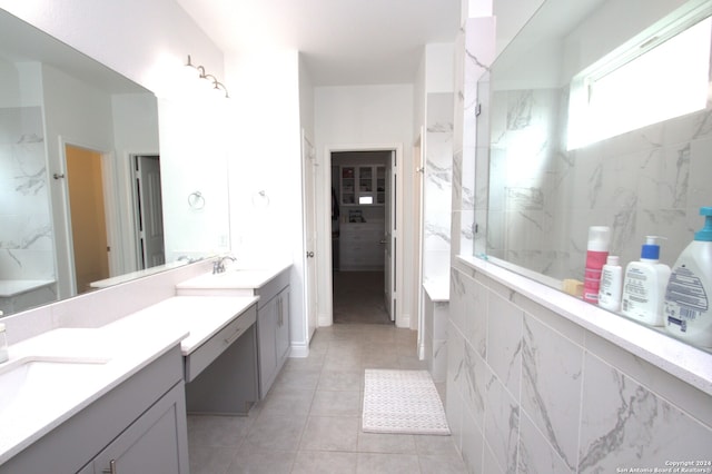 bathroom with tile patterned flooring and vanity