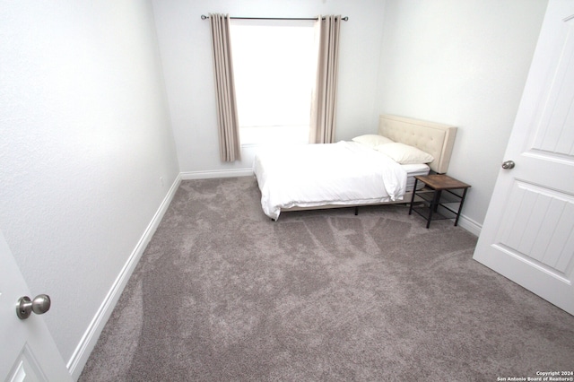 bedroom with dark carpet