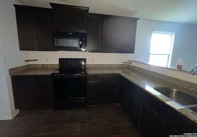 kitchen with dark hardwood / wood-style flooring, sink, and black appliances