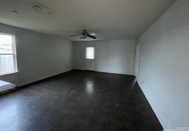 empty room featuring ceiling fan