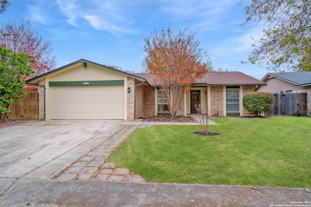 single story home with a garage and a front lawn