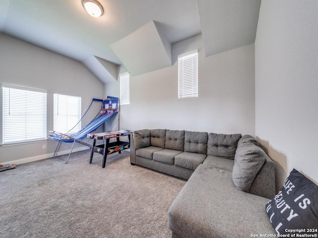 living room featuring carpet flooring and lofted ceiling