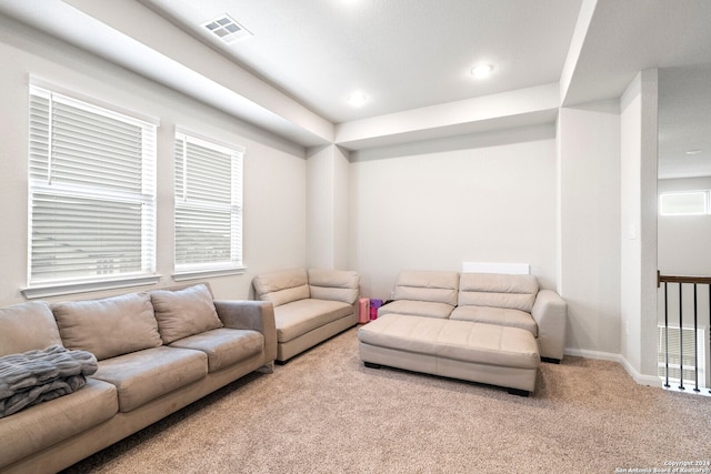 living room with light colored carpet