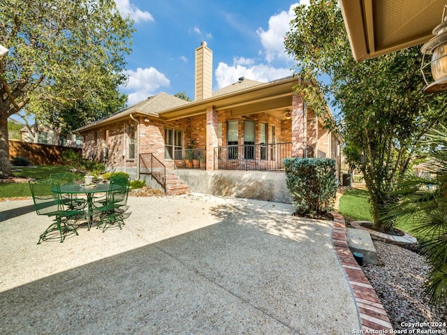 rear view of house with a patio