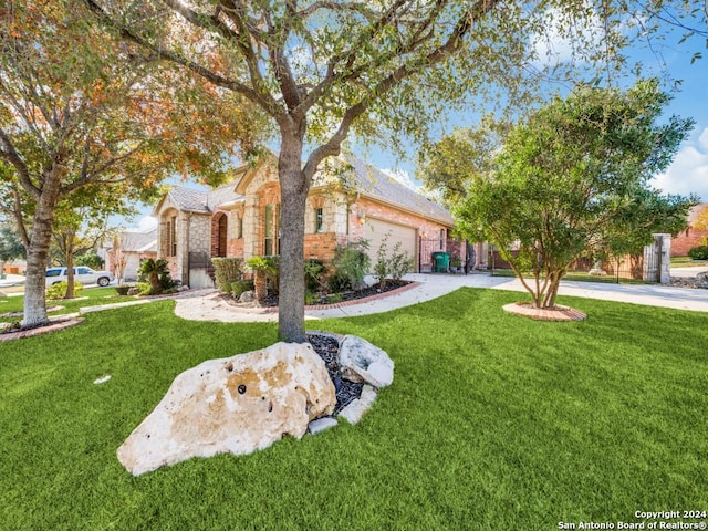 view of front of property with a garage and a front yard