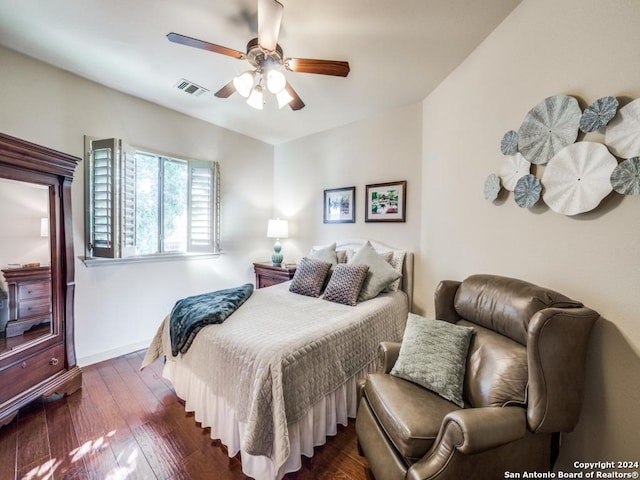 bedroom featuring ceiling fan and dark hardwood / wood-style flooring