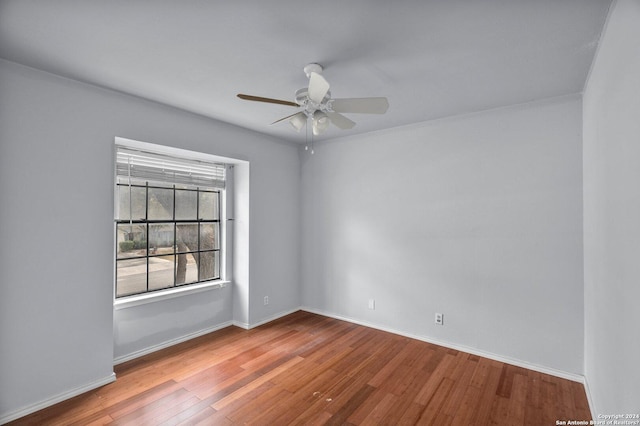 empty room with light hardwood / wood-style floors and ceiling fan