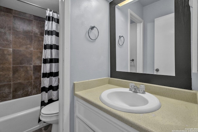 full bathroom with shower / tub combo, vanity, and toilet