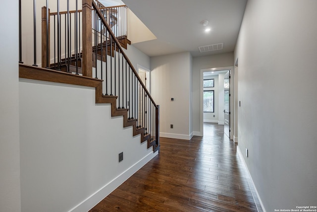 foyer with dark hardwood / wood-style flooring