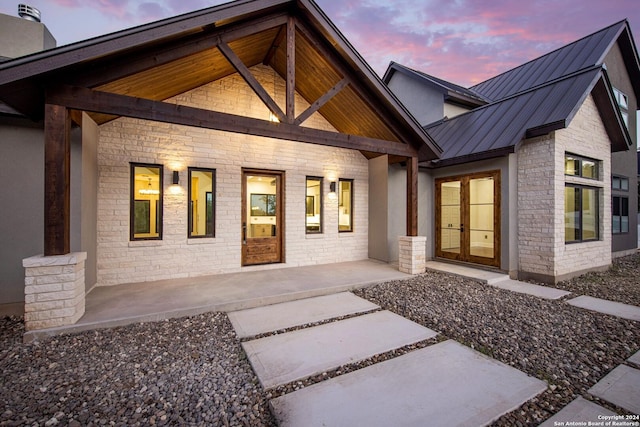 exterior space featuring french doors and a porch