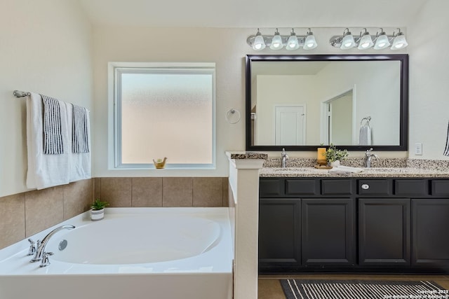 bathroom with a bathtub and vanity