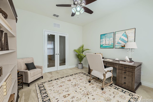 carpeted office featuring french doors and ceiling fan