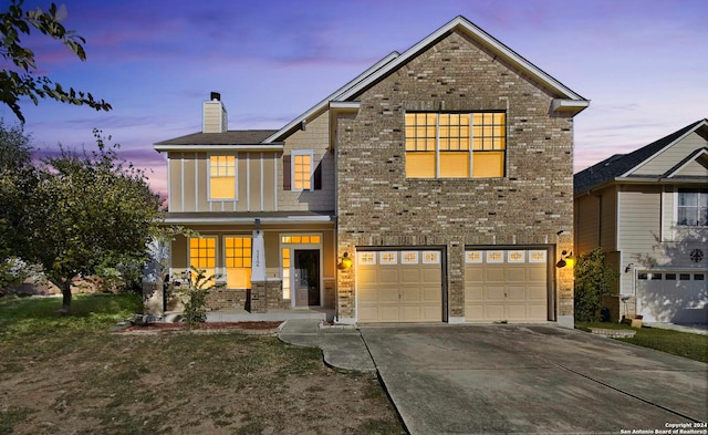 view of front of home featuring a porch and a garage