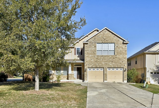 view of front of house featuring a garage and a front lawn