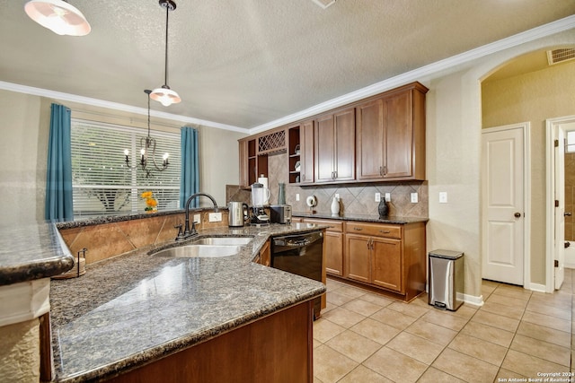 kitchen featuring sink, dark stone counters, pendant lighting, a textured ceiling, and light tile patterned floors