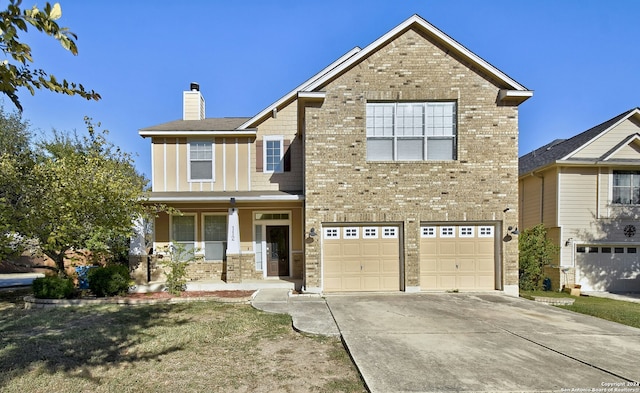 view of front of property with a porch and a garage