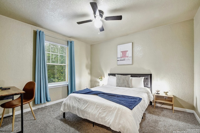 bedroom with carpet, a textured ceiling, and ceiling fan