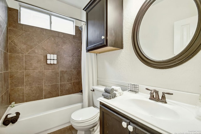 full bathroom featuring vanity, shower / bath combo, and toilet