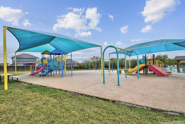 view of jungle gym with a lawn