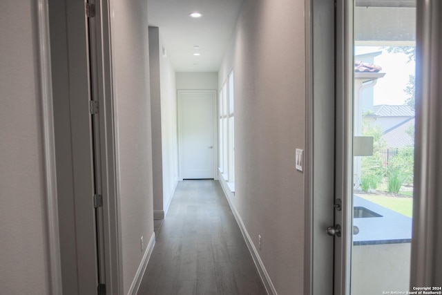 corridor featuring dark hardwood / wood-style flooring