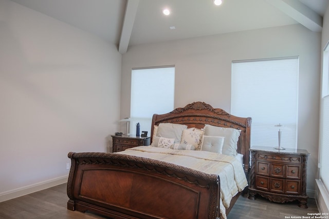 bedroom featuring lofted ceiling with beams and dark hardwood / wood-style floors