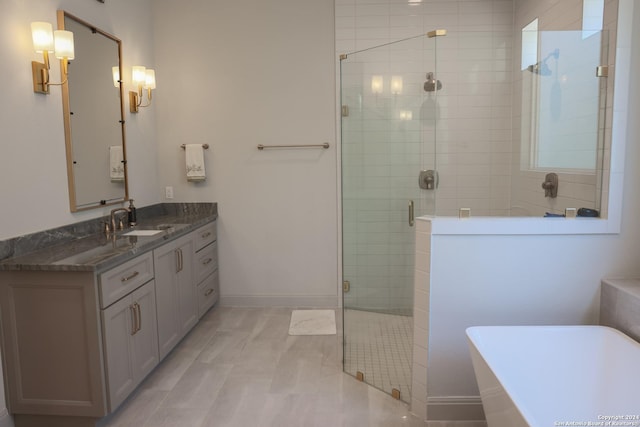 bathroom with shower with separate bathtub and vanity