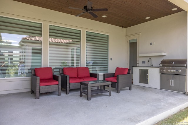 view of patio / terrace featuring an outdoor kitchen, an outdoor hangout area, area for grilling, ceiling fan, and sink