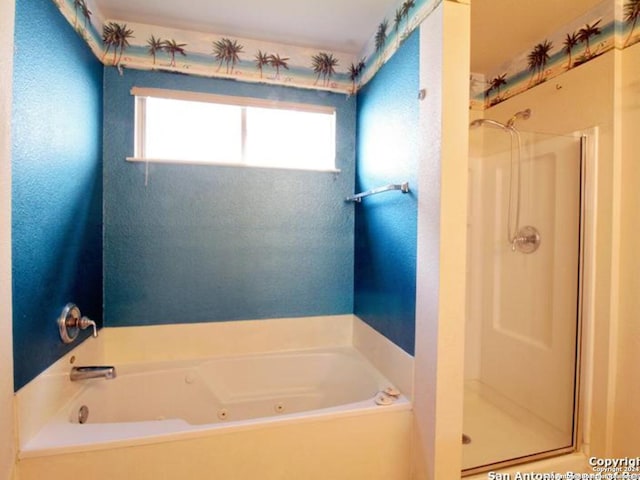 bathroom featuring separate shower and tub