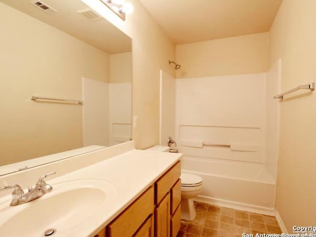 full bathroom with shower / bathing tub combination, vanity, and toilet