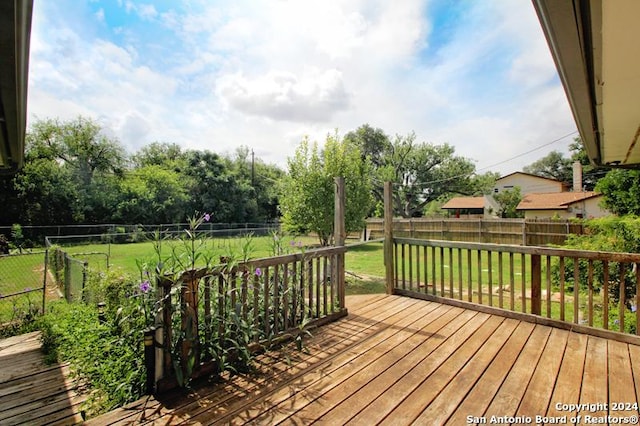 wooden deck with a yard