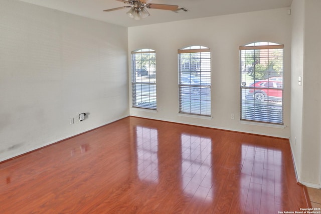 spare room featuring ceiling fan and hardwood / wood-style flooring