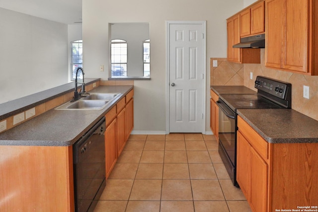 kitchen with light tile patterned flooring, sink, kitchen peninsula, and black appliances