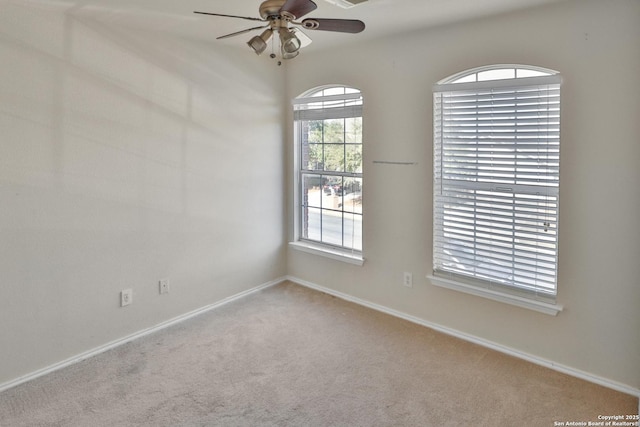 unfurnished room with carpet and ceiling fan