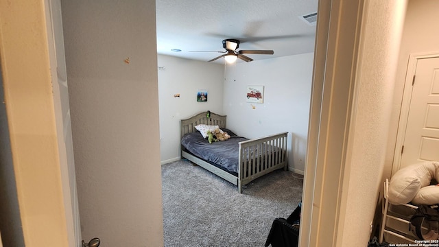 bedroom featuring ceiling fan and carpet floors