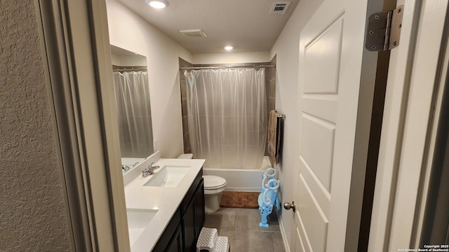 full bathroom with tile patterned floors, vanity, toilet, and shower / bath combo