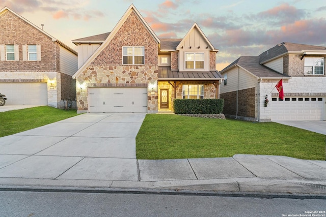 view of front of house featuring a yard and a garage