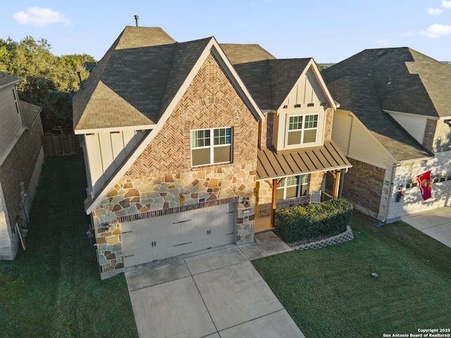 view of front of house with a garage and a front yard