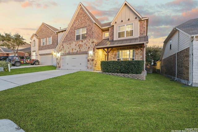 view of front of property featuring a lawn and a garage