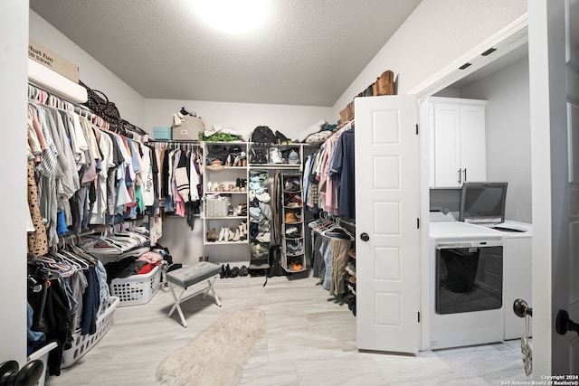 walk in closet with washer and dryer