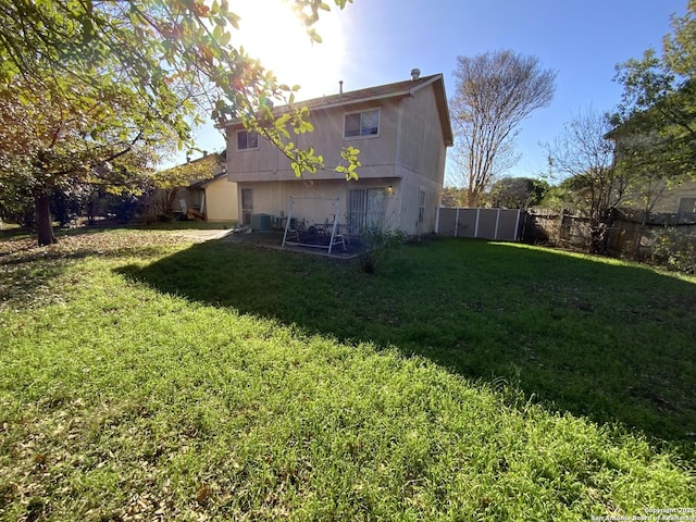 view of yard with central AC