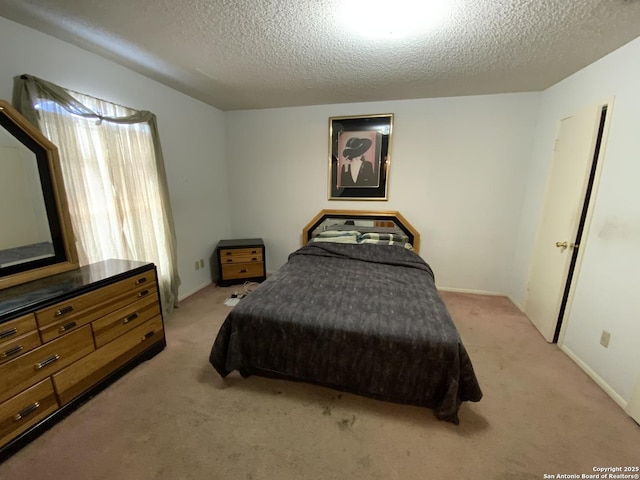 carpeted bedroom with a textured ceiling