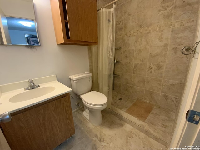 bathroom with toilet, vanity, and a shower with shower curtain