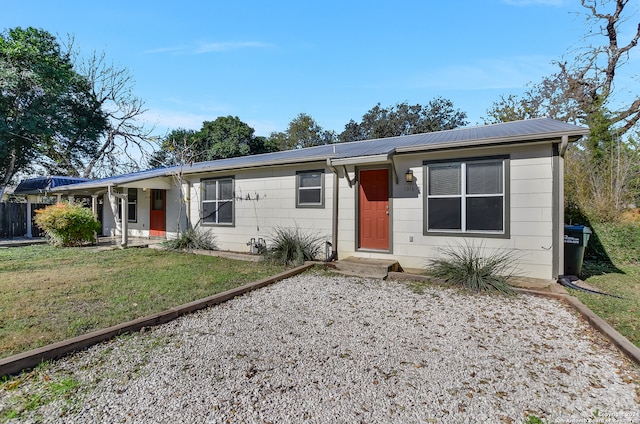 ranch-style home featuring a porch and a front yard