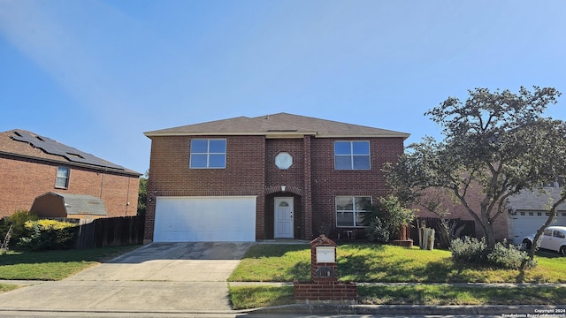 view of front property with a front yard and a garage