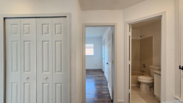 corridor featuring dark hardwood / wood-style flooring