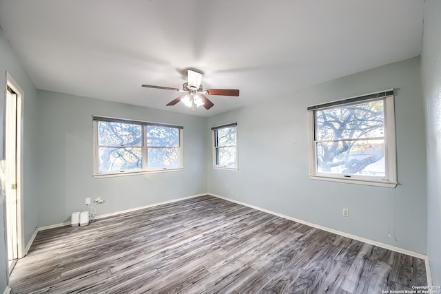 spare room featuring ceiling fan and wood-type flooring