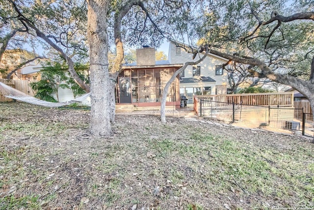 view of yard featuring a sunroom