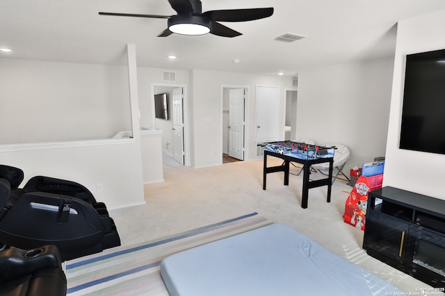 playroom featuring light colored carpet and ceiling fan