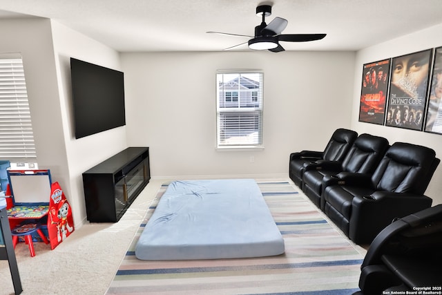 living room featuring ceiling fan and light carpet