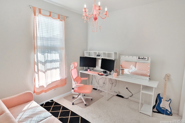 carpeted home office featuring a notable chandelier